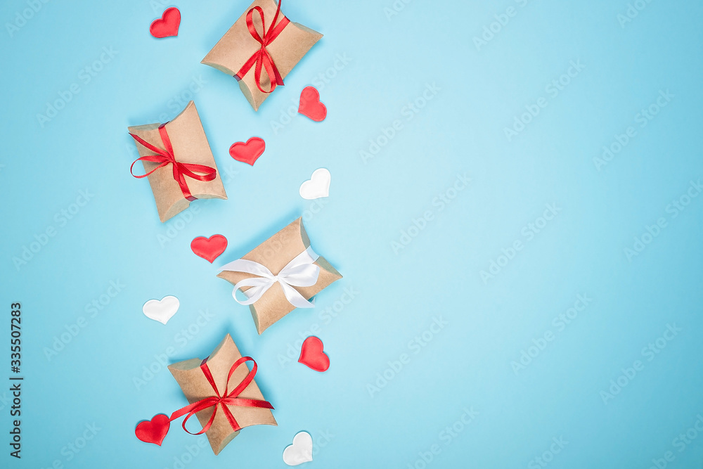 Pattern on a blue background. Gift boxes and hearts. Blank for greeting card. Valentine's Day, Mother's Day, March 8 Day background. Top view. Copy sapce