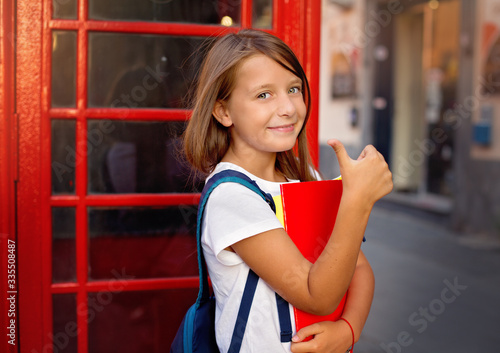 Education, school, knowledge and people concept. Cute teens girl is studying in English school
