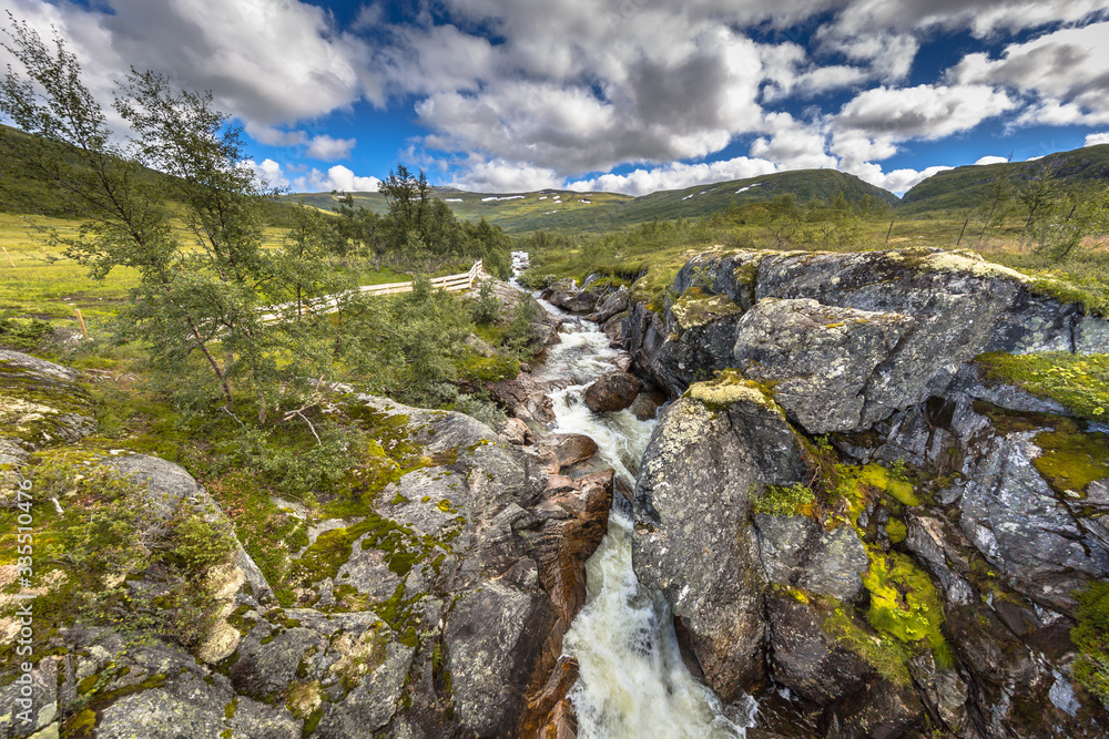 Obraz premium Waterfall in Wild river in Hardangervidda