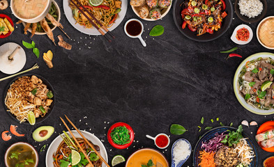 Asian food background with various ingredients on rustic stone background , top view. Vietnam or Thai cuisine.
