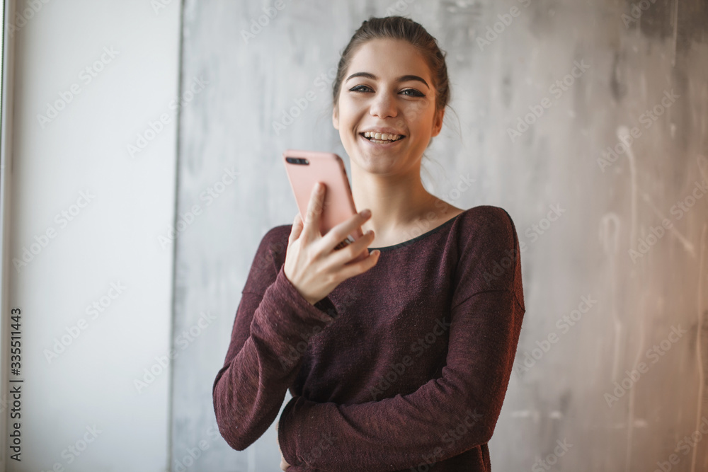 Photo of woman working from home during Coronavirus quarantine. A woman talking on phone. Staying at home Photo of woman working from home during Coronavirus quarantine. A woman talking on phone. Staying at home
