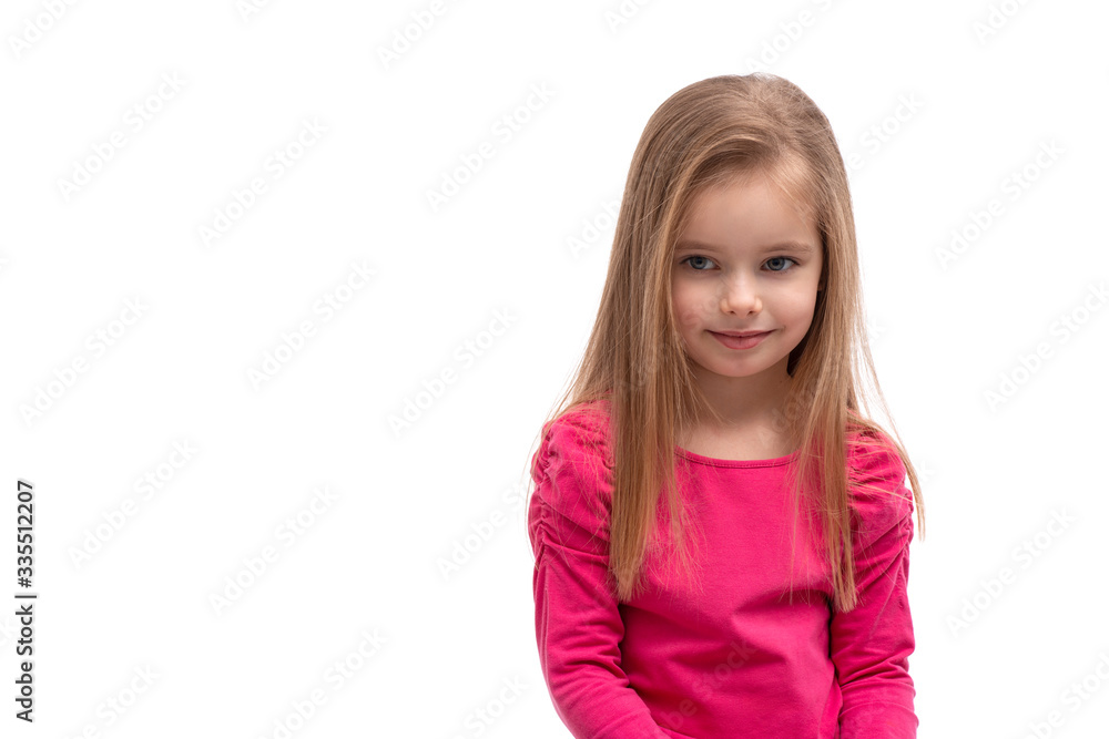 A cute blonde smiling girl with long hair and blue eyes looking aside, isolated A cute blonde smiling girl with long hair and blue eyes looking aside, isolated