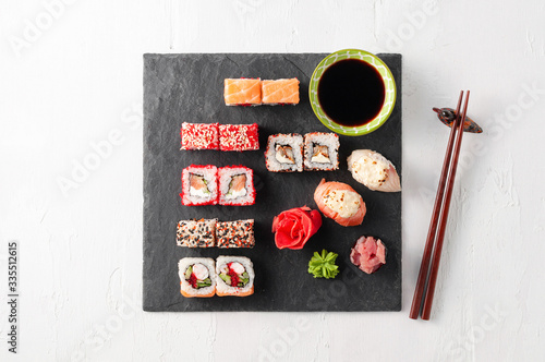Obraz na płótnie Japanese cuisine. Assorted sushi maki gunkan roll on white table w salonie