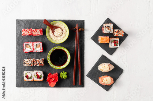 Obraz na płótnie Japanese cuisine. Assorted sushi maki gunkan roll on white table w salonie