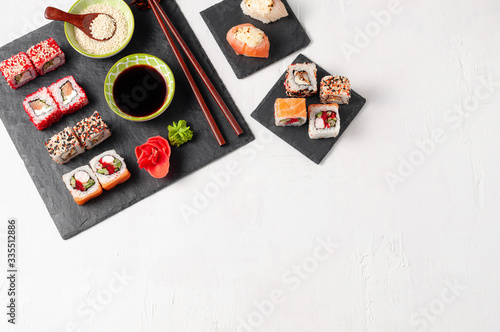 Obraz na płótnie Japanese cuisine. Assorted sushi maki gunkan roll on white table w salonie