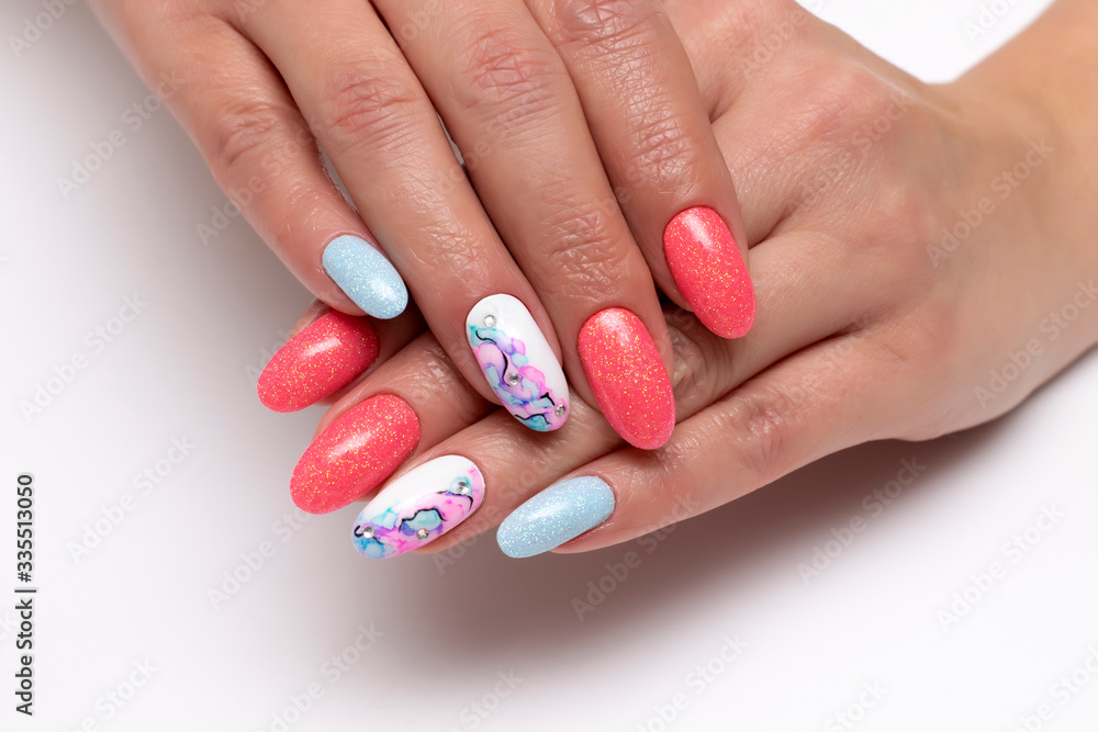 Peach, white, blue shiny manicure on oval long nails with crystals and stains on nameless nails. Summer manicure. Balloons. Abstraction on the nails. Close-up. White background.
Peach, white, blue shiny manicure on oval long nails with crystals and stains on nameless nails. Summer manicure. Balloons. Abstraction on the nails. Close-up. White background.