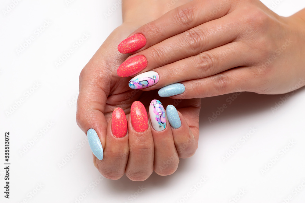 Peach, white, blue shiny manicure on oval long nails with crystals and stains on nameless nails. Summer manicure. Balloons. Abstraction on the nails. Close-up. White background.
Peach, white, blue shiny manicure on oval long nails with crystals and stains on nameless nails. Summer manicure. Balloons. Abstraction on the nails. Close-up. White background.