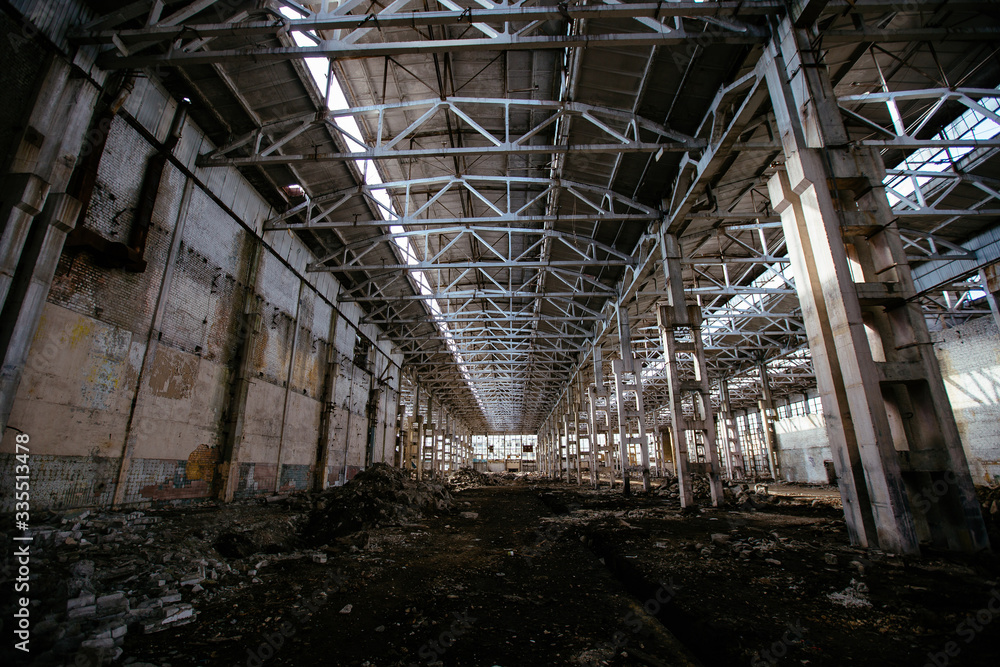 Abandoned large industrial hall waiting for demolition. Former Voronezh excavator manufacturing factory Abandoned large industrial hall waiting for demolition. Former Voronezh excavator manufacturing factory