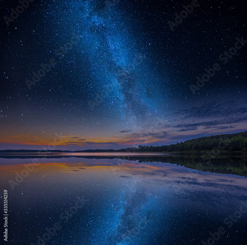 Mystical lake in starry night.
