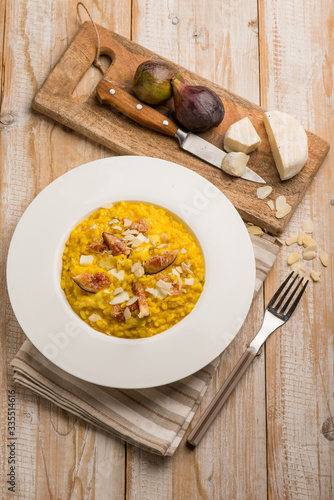 milanese risotto with cheese fig and sliced almond