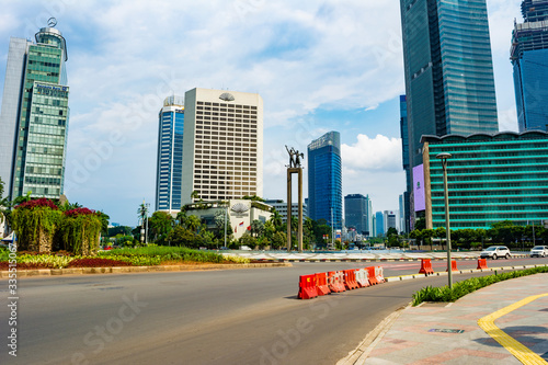 Jakarta, Indonesia - 3rd Apr 2020: Deserted Jakarta streets in Bundaran HI (HI Roundabout). People are staying at home (working from home) due to dear of covid-19. © HaniSantosa