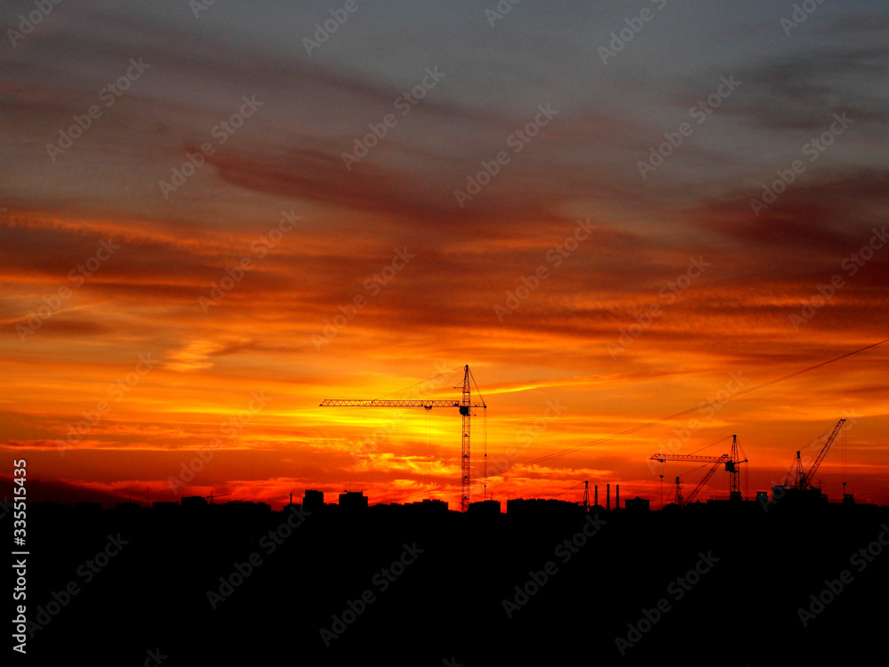 construction crane on the background of the sunset