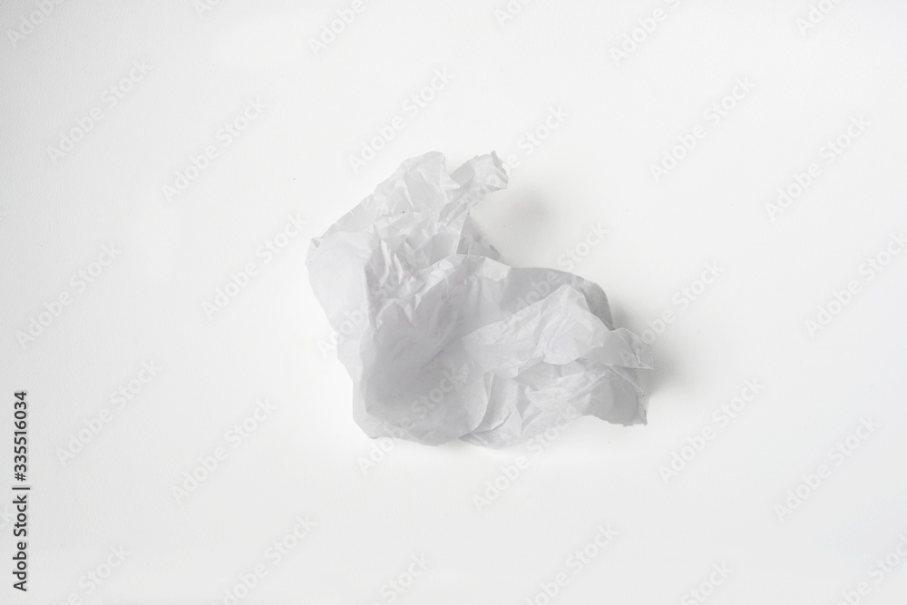 Used crumpled and squeezed paper ball isolated white background