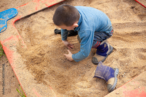 A child plays on the street.