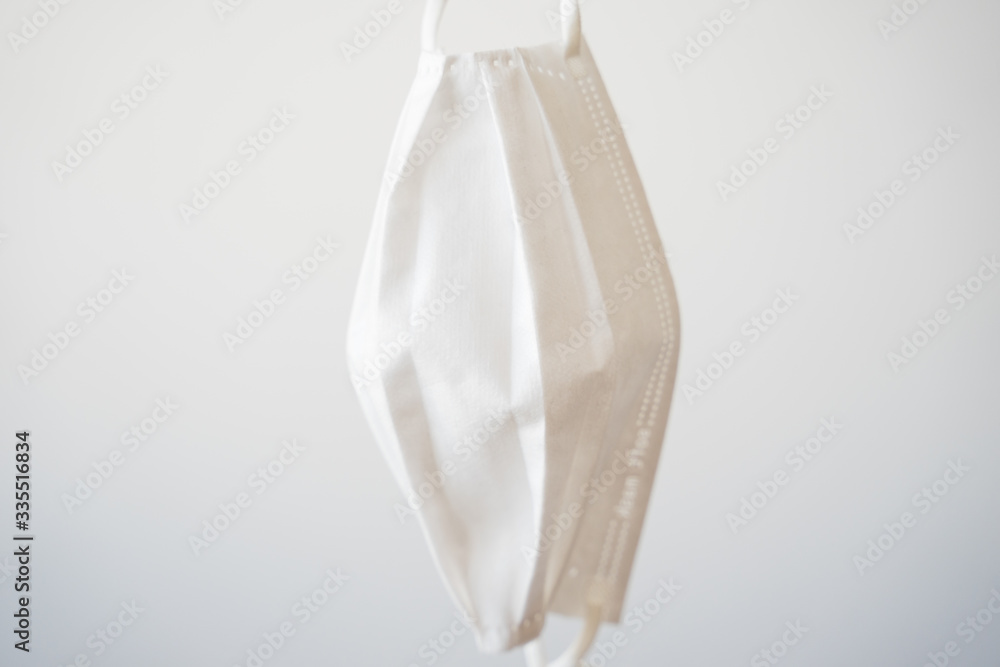 Medical mask close up isolated on white background, Corona protection.
Medical mask close up isolated on white background, Corona protection.