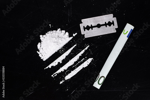 Portion of Cocaine on a dark plate (close-up)