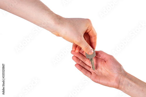 Person hands over keys to house isolated on white background