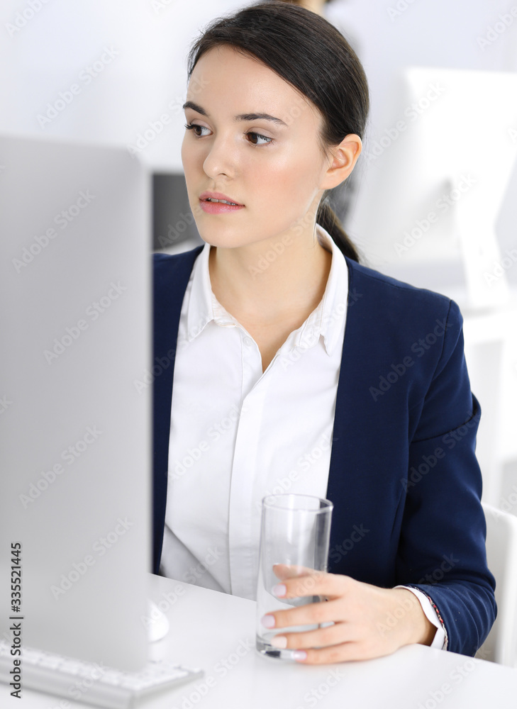 Businesswoman working with computer in office. Lawyer or accountant sitting at work, headshot. Business concept Businesswoman working with computer in office. Lawyer or accountant sitting at work, headshot. Business concept