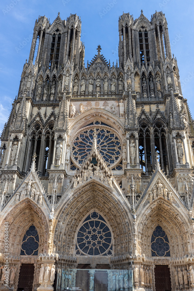 Low angle view at the front of cathedral Notre Dame in Reims
