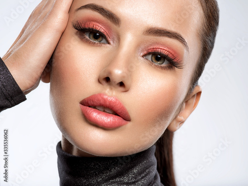 Fototapeta Portrait of beautiful young woman with bright pink makeup