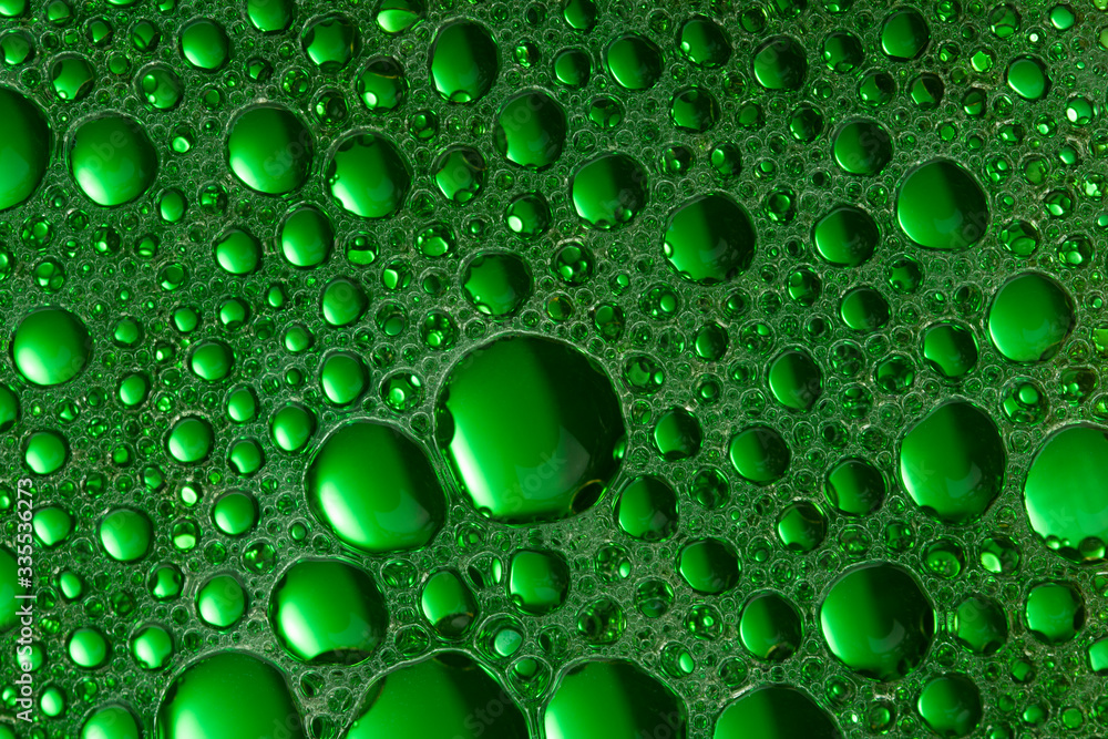 Abstract Green water bubbles background. Oil and  Water close up