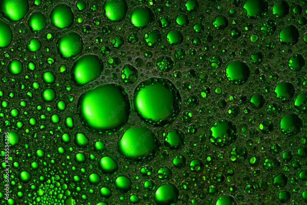 Abstract liquid background  green color. Close up