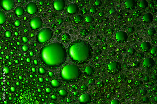 Abstract liquid background green color. Close up