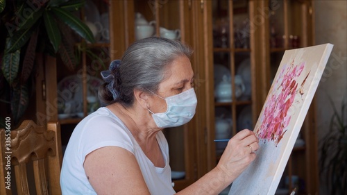 Art, hobby, job and creative occupation concept. Woman wearing hygienic mask