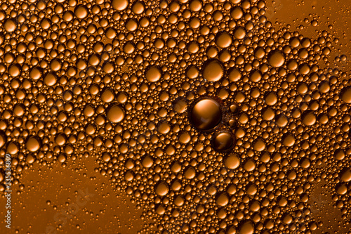 Yellow orange water drops background. Soft focus , close up