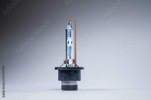 New xenon lamp on a gray gradient background. The concept of discharge lamps to replace conventional incandescent lamps
