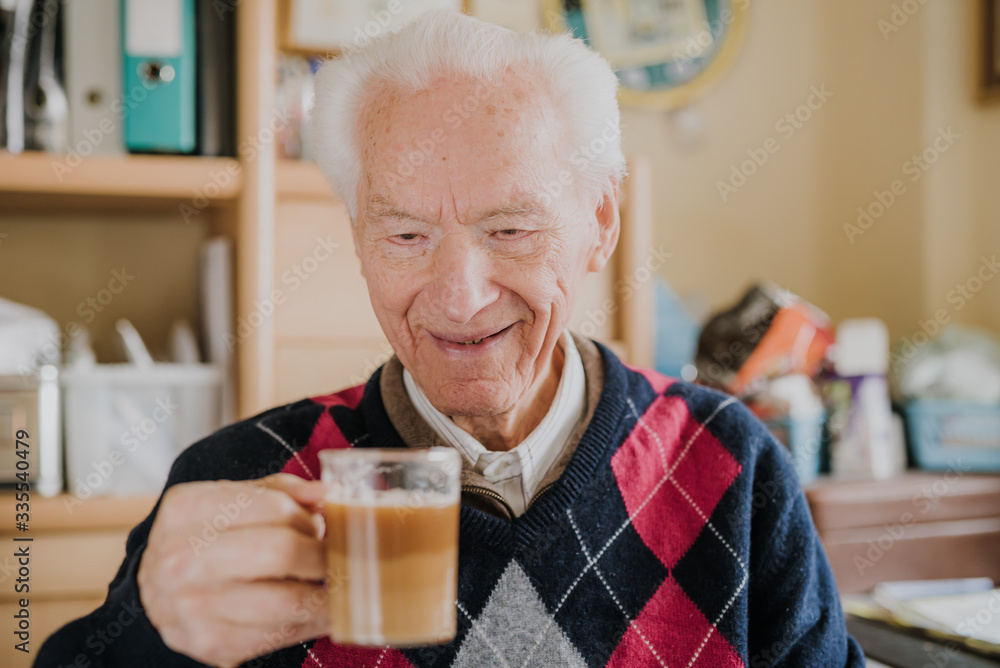 Portrait of happy senior drinking coffee Portrait of happy senior drinking coffee