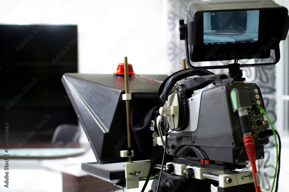 TV camera in the Studio. Teleprompter and professional high-definition video camera on a tripod. TV camera in the Studio. Teleprompter and professional high-definition video camera on a tripod.