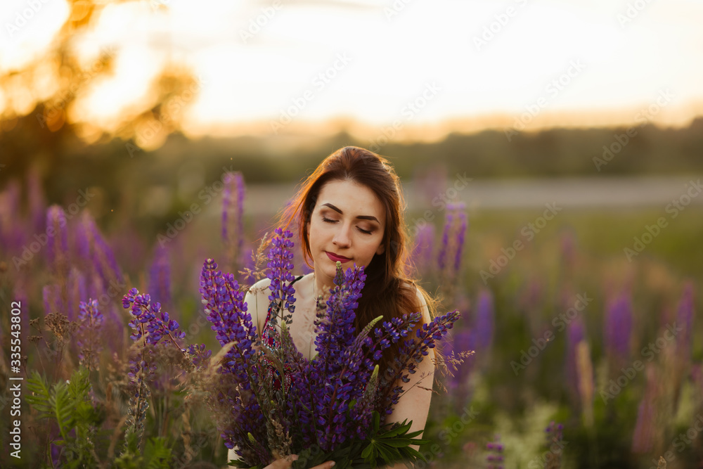 happy young girl smiling, holding hands in lavender. Soft focus, close-up happy young girl smiling, holding hands in lavender. Soft focus, close-up