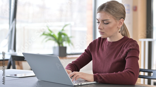 Professional Young Woman using Laptop in Office Free Download Professional Young Woman using Laptop in Office - GFXLoad