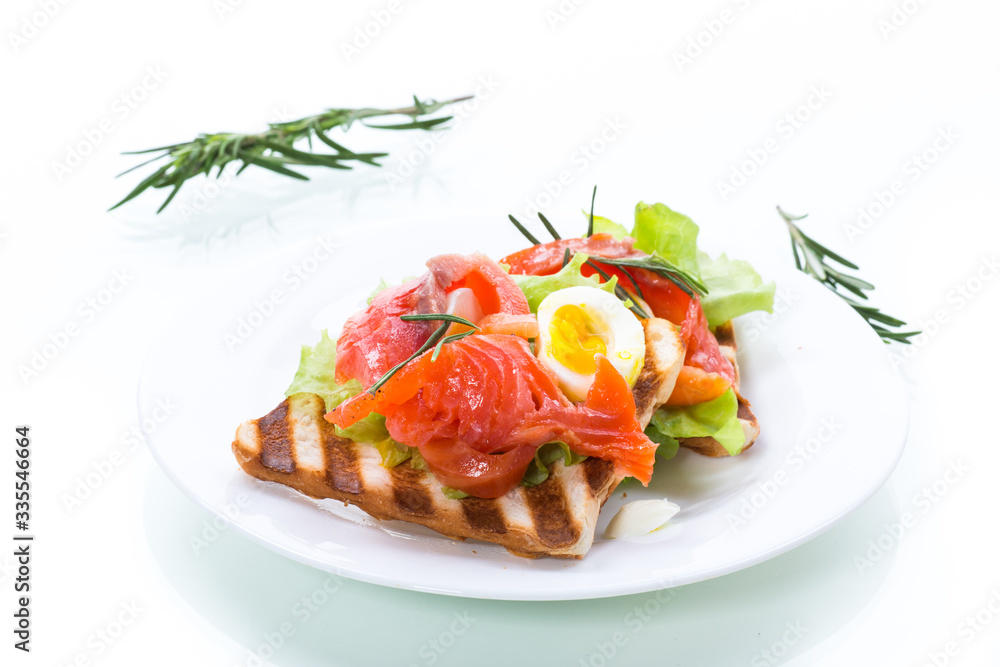fried bread toast with salad leaves and salted red fish fried bread toast with salad leaves and salted red fish