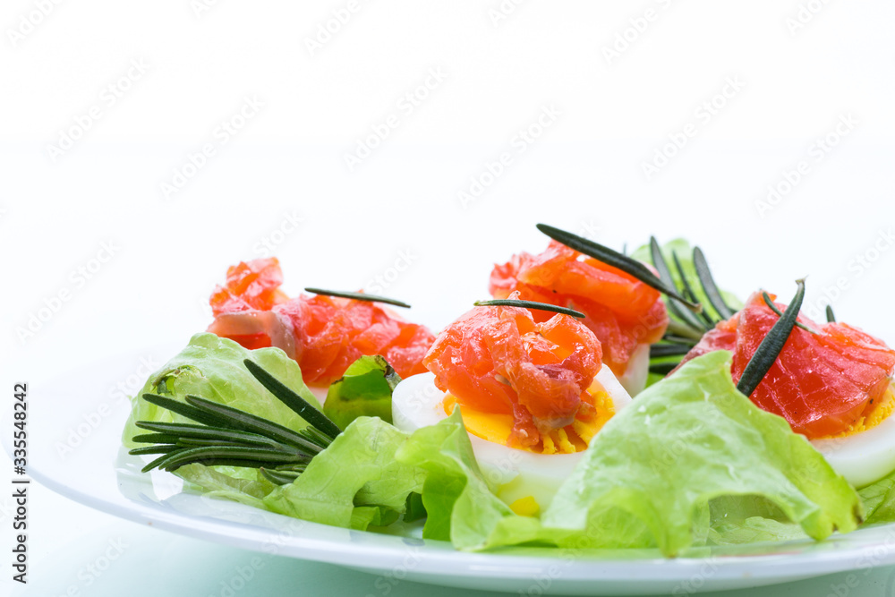 boiled eggs with salted red fish and salad leaves boiled eggs with salted red fish and salad leaves