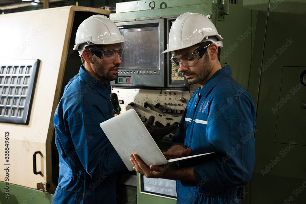 Industrial workers are working on projects in large industrial plants with many devices. Industrial workers are working on projects in large industrial plants with many devices.