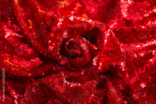 red shiny sequined pleated sequin fabric as background and texture
