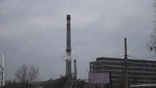 Wallpaper Mural Industrial power plant emitting carbon dioxide from smokestack into the atmosphere. Gray smoke is poured from the chimney pipe at overcast day. Environmental pollution and global warming concept Torontodigital.ca