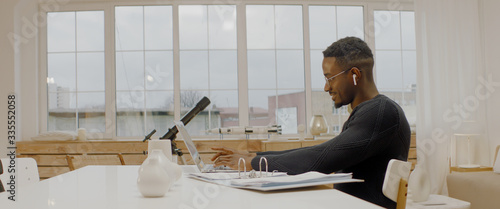 African American male remote working from home, having work confrence video call. Stay home, quarantine remote work photo