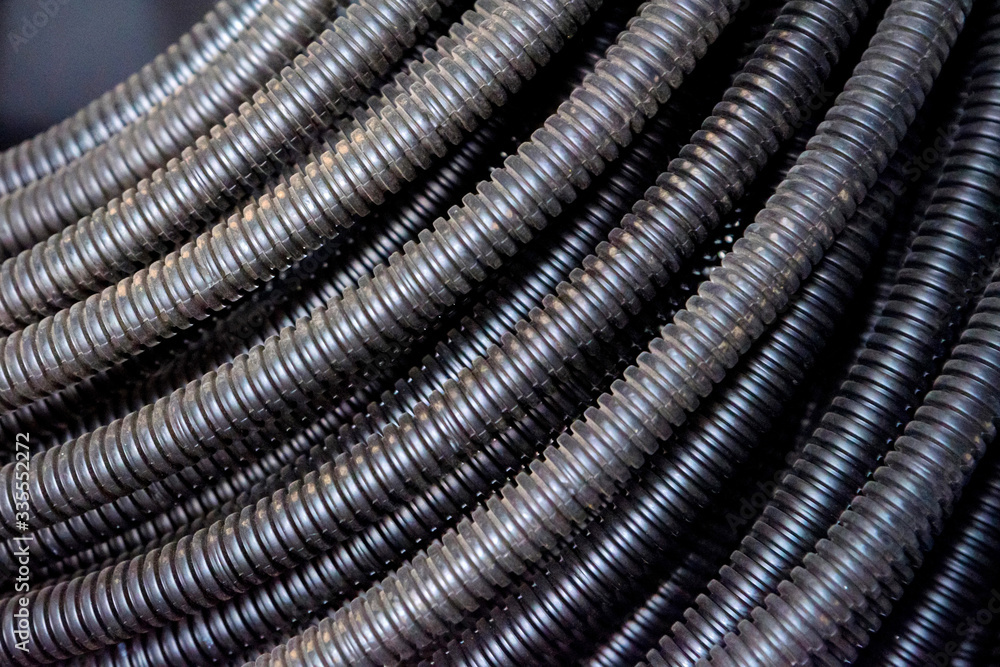 Close up of black plastic corrugated pipe Close up of black plastic corrugated pipe