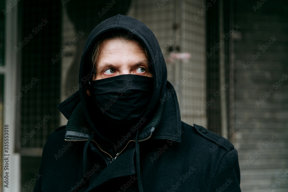 Man in Mask and Hood. Boy in Black Mask and Hoodie. Coronavirus epidemic. Man in Mask and Hood. Boy in Black Mask and Hoodie. Coronavirus epidemic.