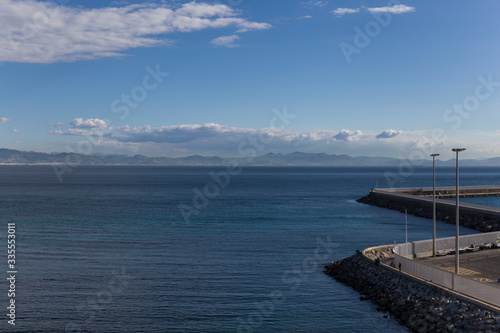 coastal landscape  calm blue sea  clear sky