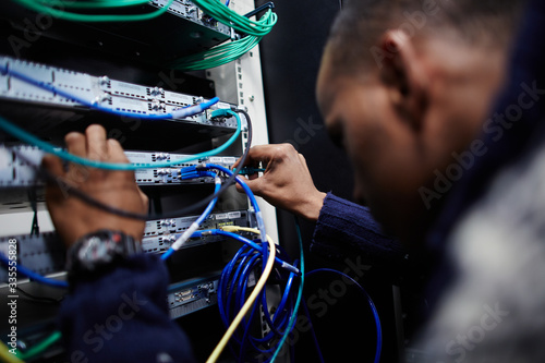 Photos Service engineer working on a server
