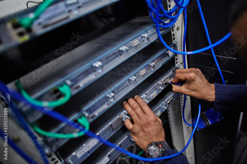Plakat w ramie IT engineer working on a server