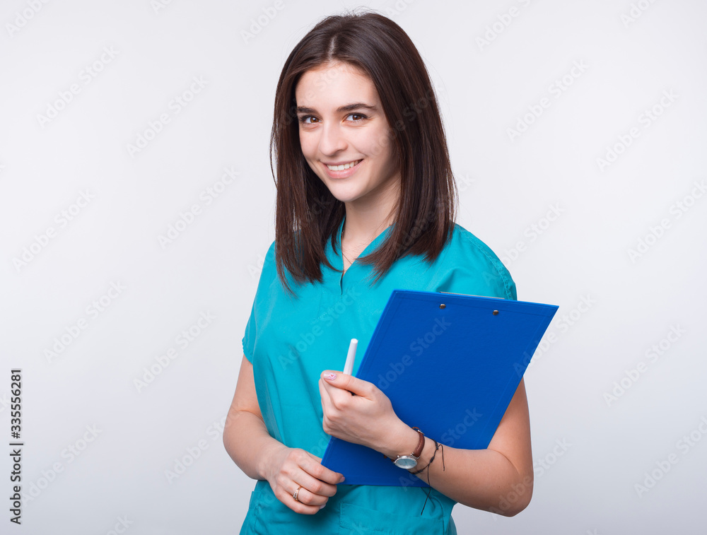 I love being a doctor. Portrait of a young female smiling and holding paper board on white background. I love being a doctor. Portrait of a young female smiling and holding paper board on white background.