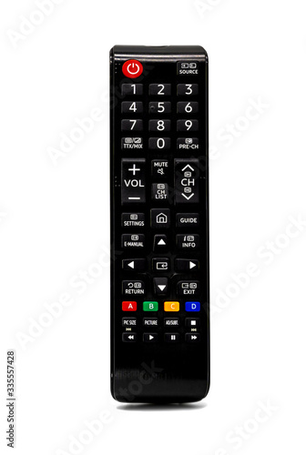 Black TV remote control with a colorful button on a white background or isolated