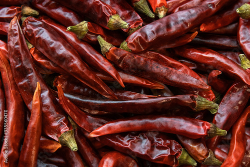 Red dried chillies placed in bulk There is a green cork. Used as a background flavoring