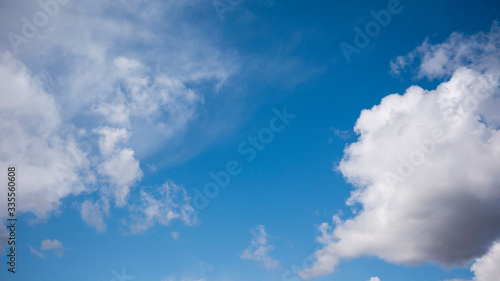 white clouds on a huge blue sky background