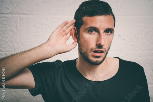 Overhears a man, tries to listen. © aeroking